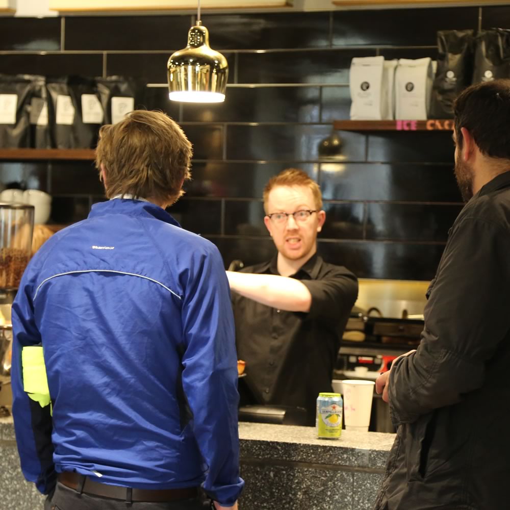 Barista serving customers at Tinderbox Princes Square, Glasgow