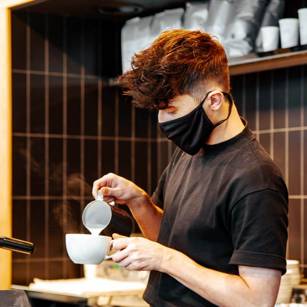 Barista serving coffee at Tinderbox at Glasgow Fort Shopping Centre, Glasgow